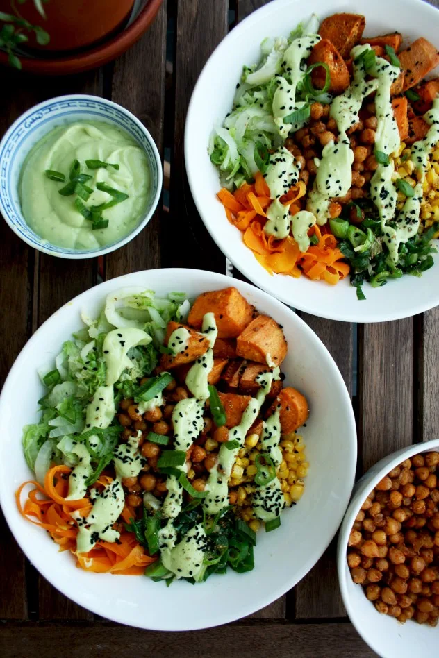 Healthy Veggie Bowls Recipe: Roasted Sweet Potatoes and Chick Peas with Stir Fried Napa Cabbage, Corn, Carrots and Scallions with Avocado Dressing.