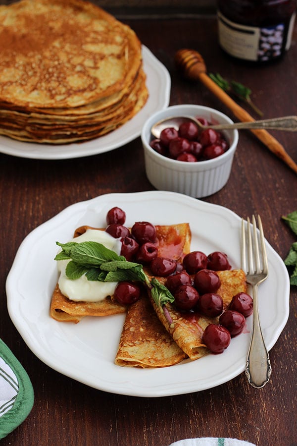 Russian Blinchiki with Cherries on a Plate