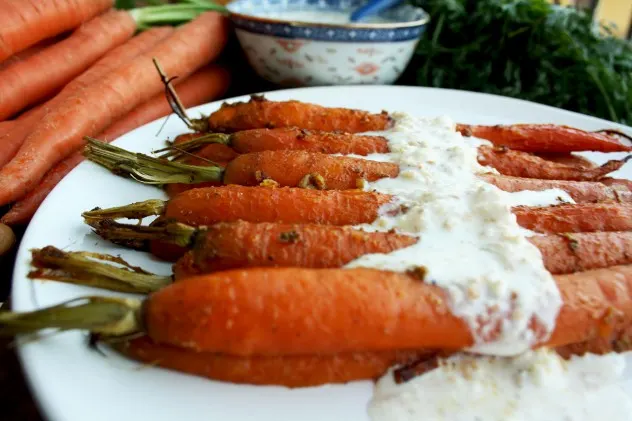 A new healthy way to enjoy carrots: Indian spiced roasted carrots with 5-minutes cashew feta dip. Flavorful, unusual and easy-to-make. Vegan recipe provided