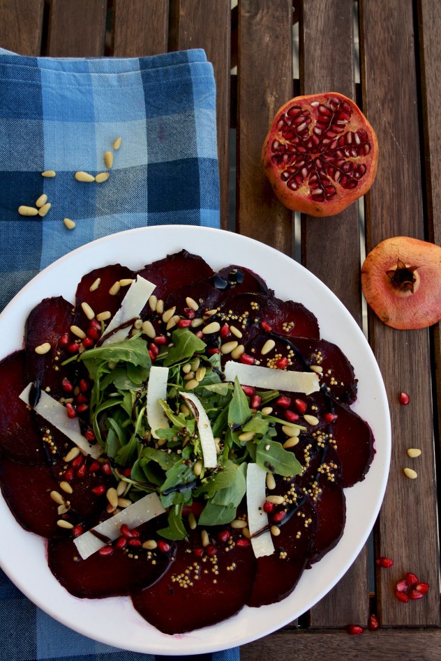 A beautiful, effortless, healthy and flavorful beetroot carpaccio with orange mustard vinaigrette and pomegranate seeds, served with parmesan and arugula.
