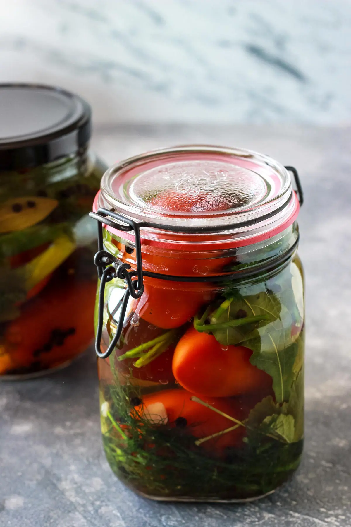 Pickled tomatoes in a jar.