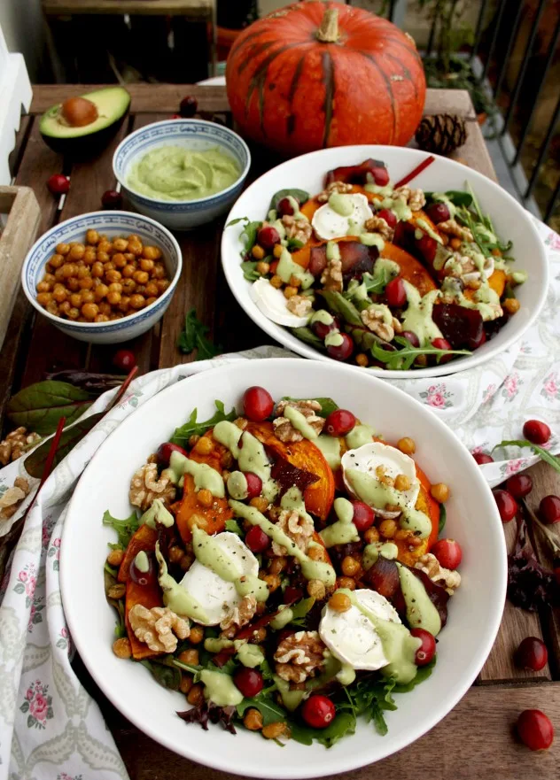 Colorful and healthy Warm Winter Salad with Pumpkin, Goat Cheese, Cranberries and Avocado Dressing. Comforting, delicious and easy holiday meal ready in 30 minutes!