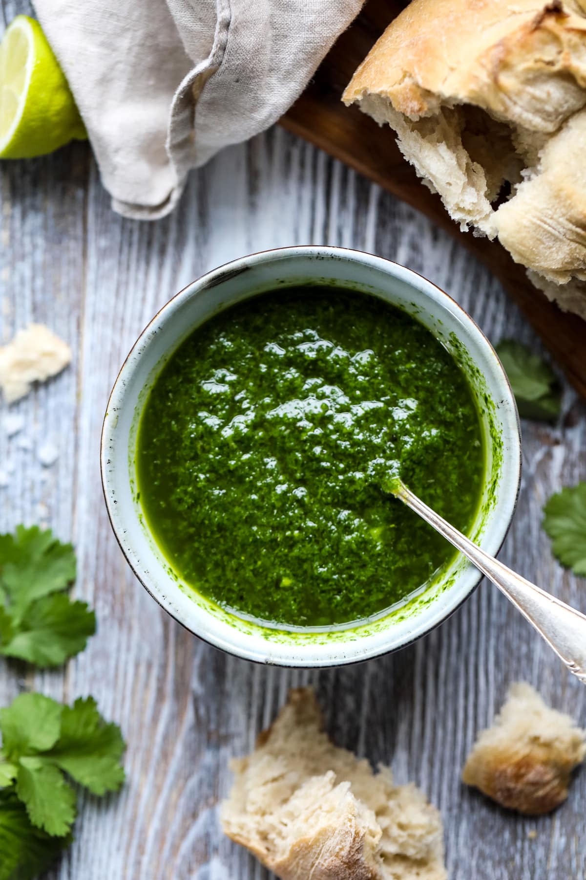 Canarian Green Sauce in a Bowl with a Spoon.