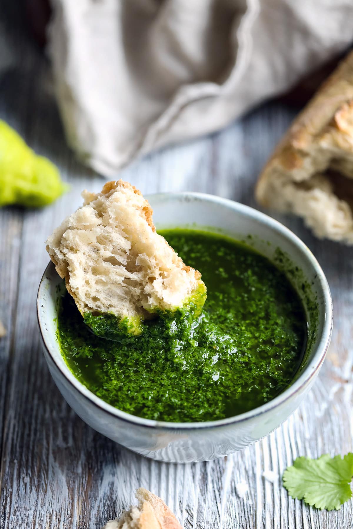 Mojo Verde in a Bowl with a Piece of Bread.