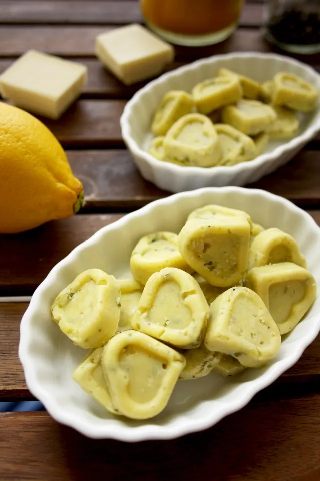 Three Chocolate Truffles Recipes - White Chocolate Hearts with a Lemon Next to Them on the Table