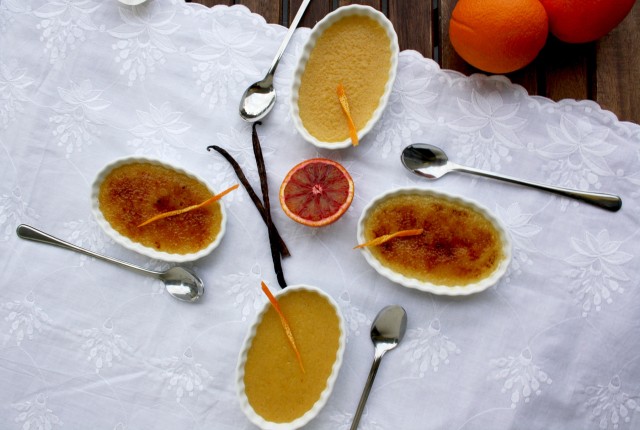 Blood Orange Crème Brûlée with Oranges on the Side of the Frame