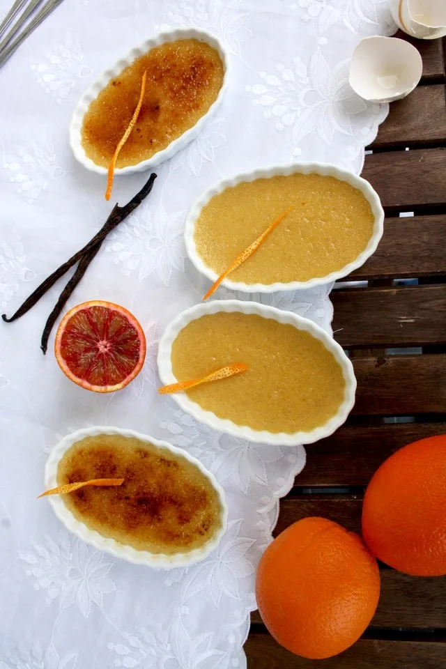 Blood Orange Crème Brûlée - Served to the Table with Blood Oranges Around