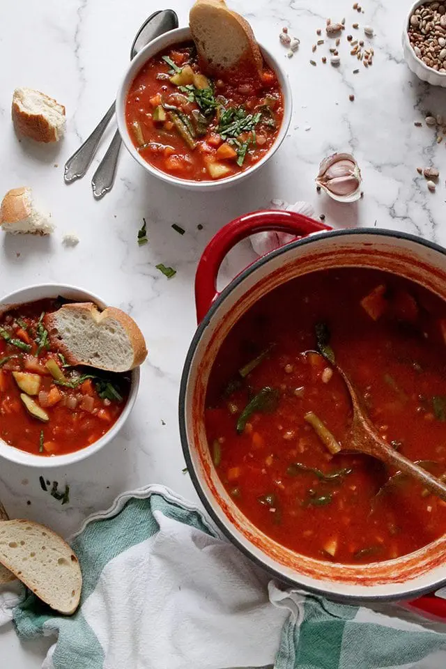 Vegan Minestrone Soup in a Pot and Bowls