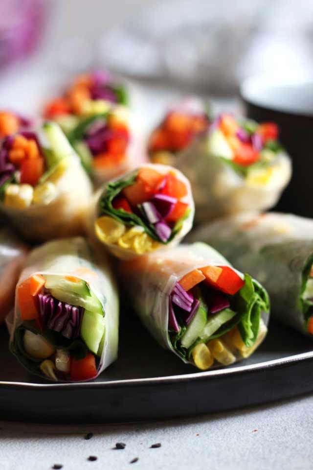 Fresh Vegan Spring Rolls Closeup on All Rolls on the Tray Ready for Serving