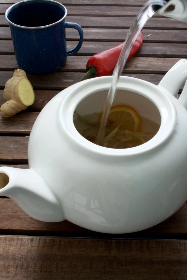Natural Flu Remedy: Magic 4-Ingredient Tea Pouring Hot Water into the Pot