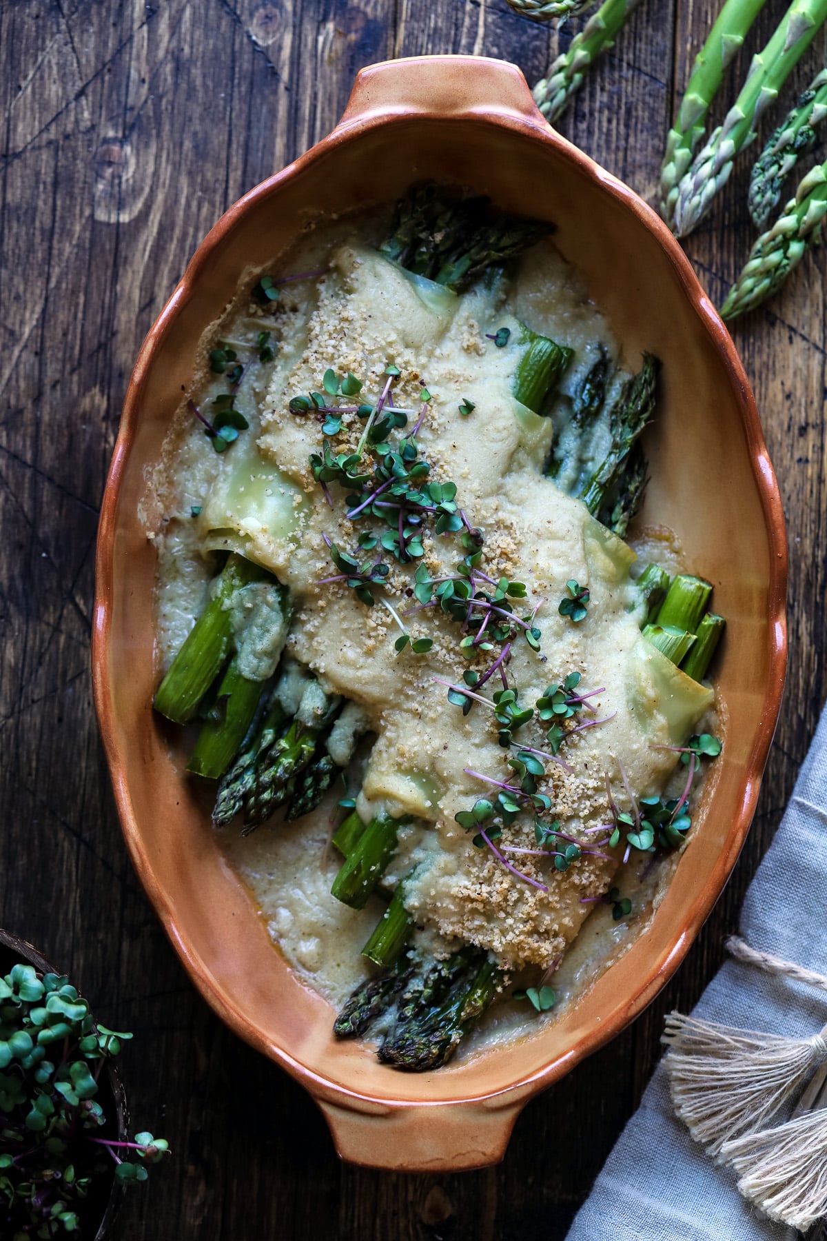 Baked asparagus cannelloni in a baking dish.