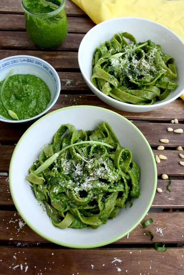 Easy Green Pesto Pasta Served in Two Bowls with Extra Pesto on the Side