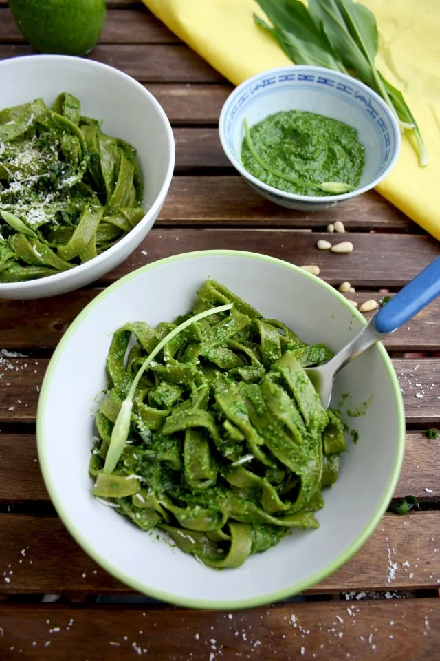 Easy Green Pesto Pasta with a Fork Inside One of the Bowls