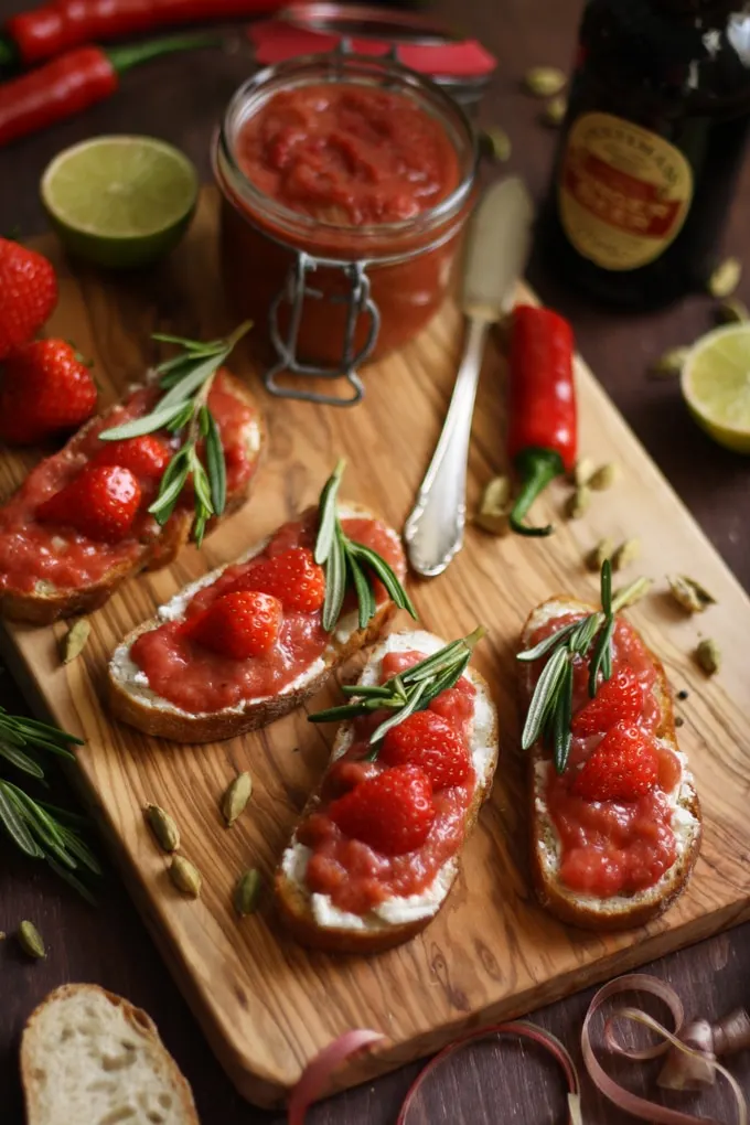 Goat Cheese Crostini with Rhubarb Chutney Beautiful Composition with Four Servings and Ingredients Around ont he Table