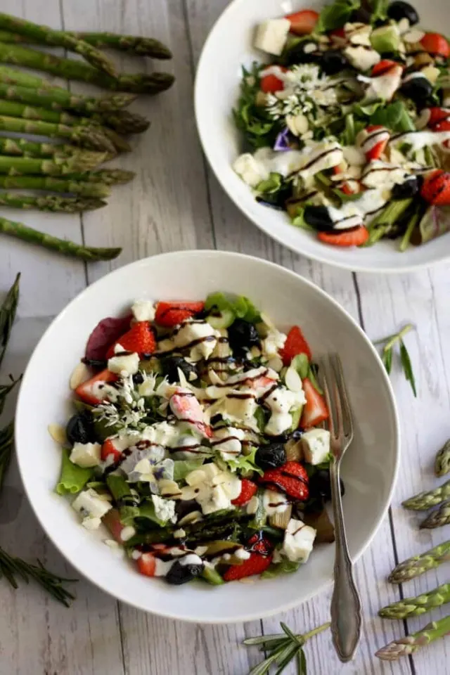 Strawberry Poppy Seed Salad with Asparagus and Rhubarb Overhead on Two White Plates with Salad