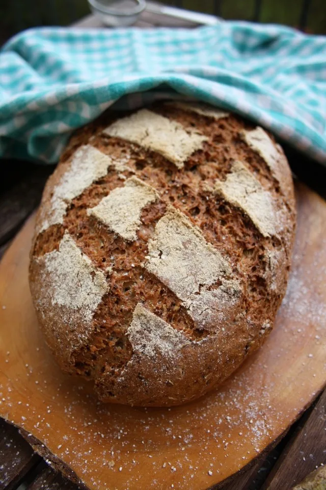 A loaf of Beer Bread dusted with flour.