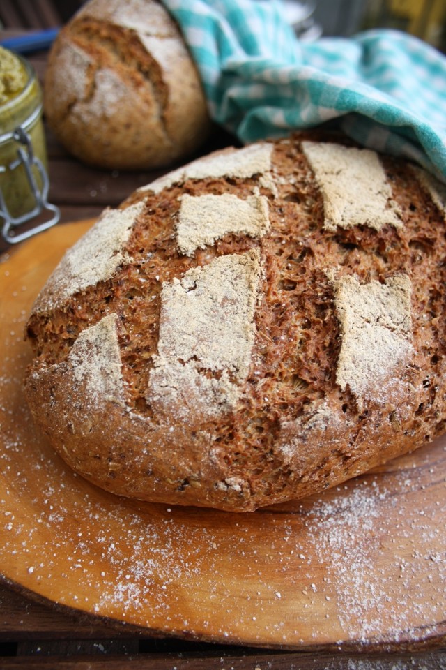 Easy No-Knead Beer Bread Composition with A cloth in Blue Squares Blurred in the Background