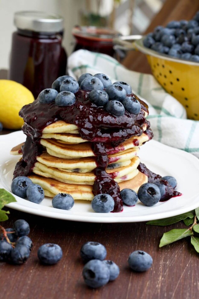 Blueberry Ricotta Pancakes with Lemon and Blueberry Jam in the Background