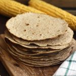 Homemade Whole Wheat Tortilla with Corn in the Background