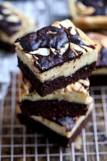 Decadent vegan chocolate brownie bars displayed on a cooling rack.