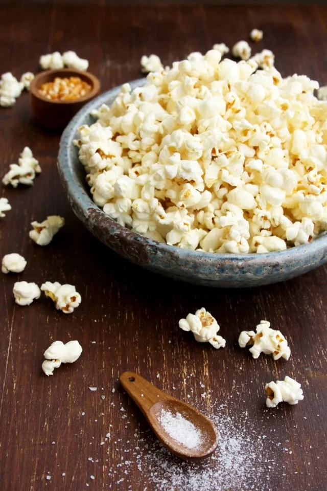 Always Perfect Stovetop Popcorn Bowl with Popcorn Around on the Table