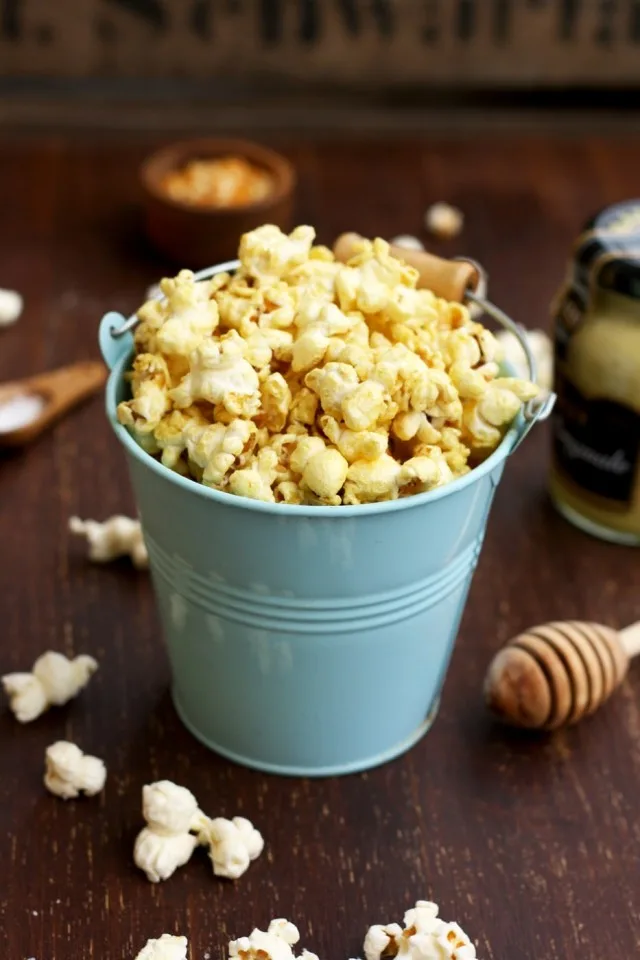 Always Perfect Stovetop Popcorn Side Shot of a Tiny Cute Blue Bucket Full of Popcorn