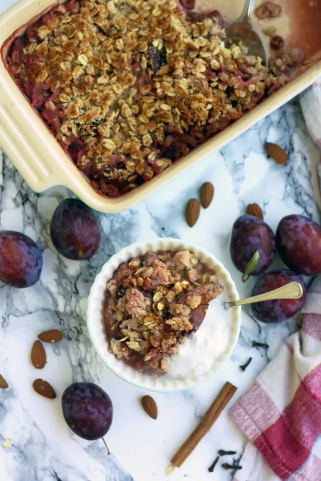 Delicious, vegan and gluten-free plum crisp with coconut makes for a great healthy dessert or breakfast. Easy 45-minute recipe from start to finish!