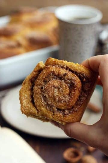 Healthy Cinnamon Sweet Potato Rolls - Holding a Roll in the Hand