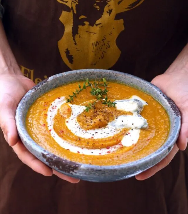 Roasted Butternut Squash Soup - Holding in Hands in a Bowl