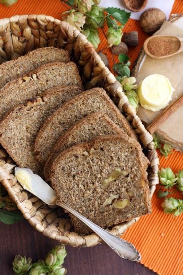 Healthy Pumpkin Bread with Walnuts in a Cute Basket with Butter and Spices