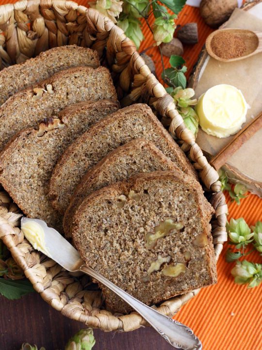 Healthy Pumpkin Bread with Walnuts in a Cute Basket with Butter and Spices