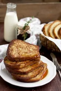 Healthier Brioche French Toast On the Table with Milk and Lots of French Toasts