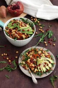 Healthy Sweet Potato Noodle Salad with Chickpeas and Rocket - Served in a Bowl and a Plate with a Pomegranate on the Side