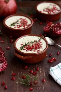 Cauliflower Soup with Pomegranate Seeds in a Brown Bowl