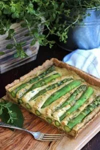 The Best Vegan Quiche Ever Served on the Wooden Tray with One Fork Next to It