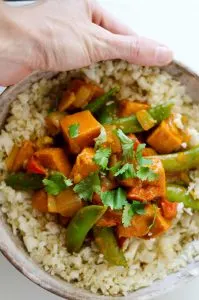 Vegetarian Red Curry Stir Fry - Holding a Bowl Full of the Meal in a Hand