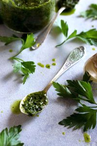 Easy 5-minute Vegan Chimichurri Sauce recipe made with parsley, garlic, lemon, vinegar and olive oil balances the flavors of any savory dish, not only steak! Perfect condiment for the summer grilling season!