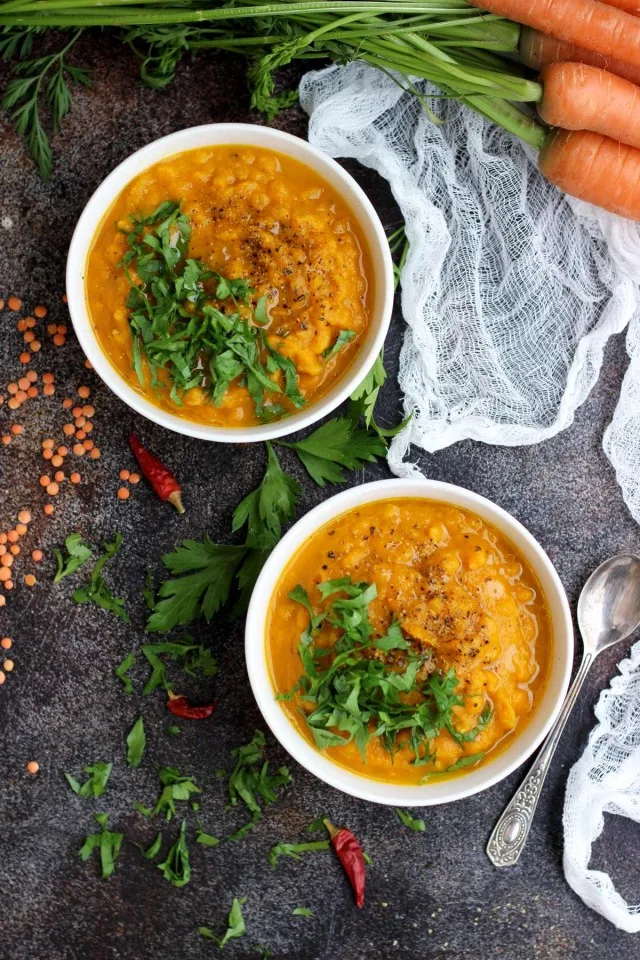 Vegan Roasted Carrot Soup with Lentils - Overhead of Two Bowls Full of the Dish