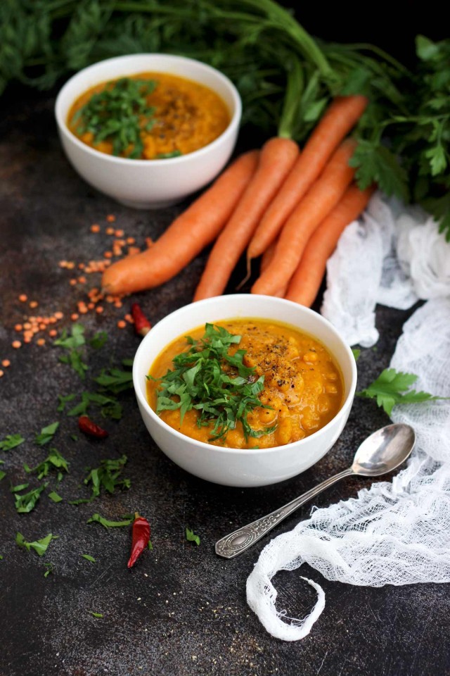 Vegan Roasted Carrot Soup with Lentils - Two Bowls of Soup with Carrot and Other Ingredients on the Table