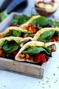 Pita Pockets with Roasted Veggies and Hummus Arranged in a Small Wooden Tray - Another Angle