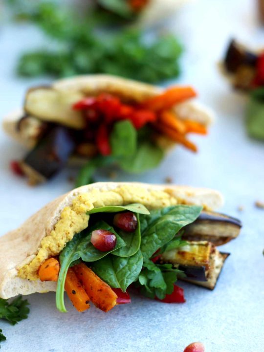 Pita Pockets with Roasted Veggies and Hummus Beautiful Closeup on One of the Pitas on the Table