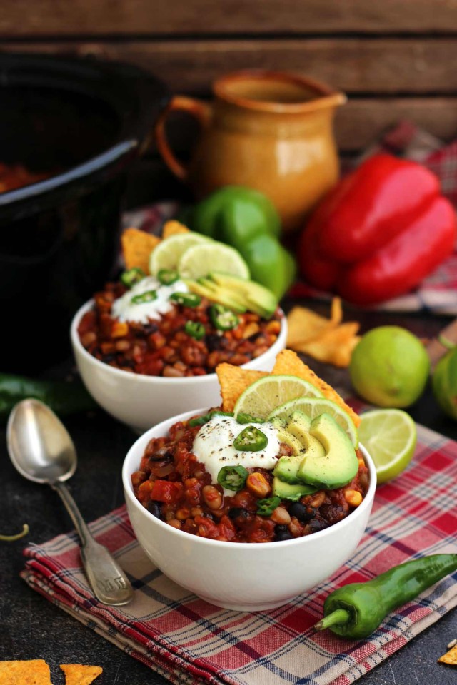 A Bowl of Vegan Chili Garnished with Vegan Sour Cream, Avocado and Jalapenos