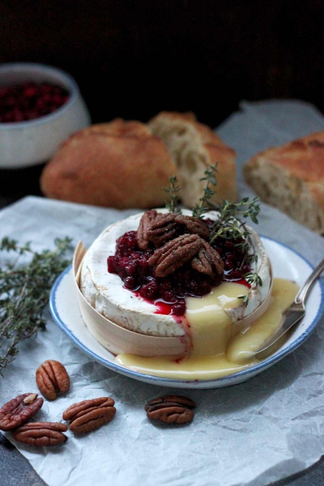 Easy Cranberry Baked Brie with Thyme on a Plate with Brie Running