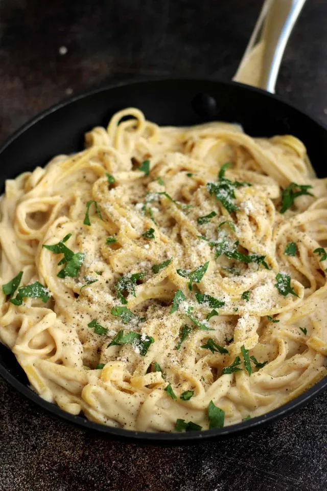 The Creamiest Vegan Fettuccine Alfredo - Garnished and Ready to Be Served
