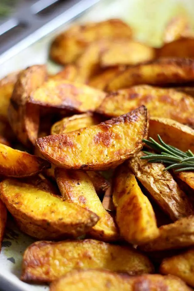 Easy Baked Potato Wedges Decorated with Rosemary Sprigs
