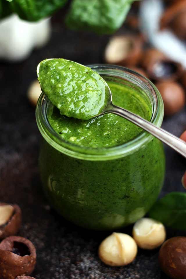 A Jar of Delicious Vegan Basil Pesto with a Spoonful on Top