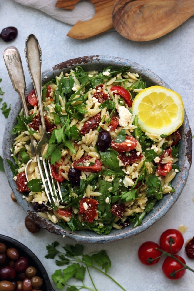 This easy Greek Orzo Salad is perfect for picnics, potlucks, BBQ and get togethers. Whenever you need an easy and healthy side dish, that is guaranteed to disappear first, make this gorgeous Greek orzo salad!