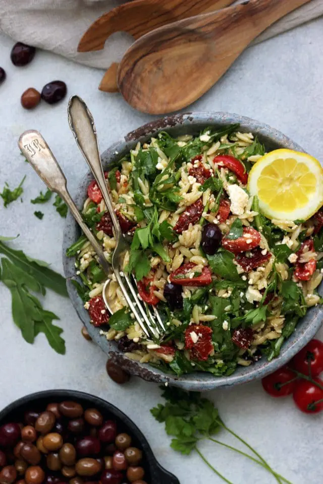This easy Greek Orzo Salad is perfect for picnics, potlucks, BBQ and get togethers. Whenever you need an easy and healthy side dish, that is guaranteed to disappear first, make this gorgeous Greek orzo salad!