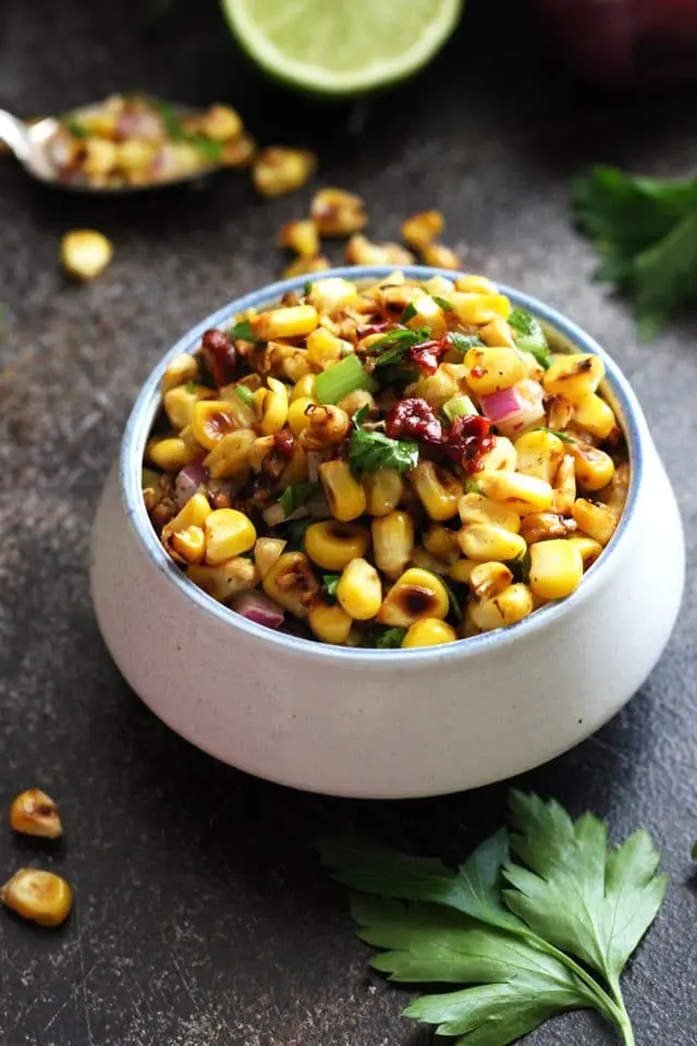 Closeup of Grilled Corn Salsa with Chipotle Peppers in a Ramekin