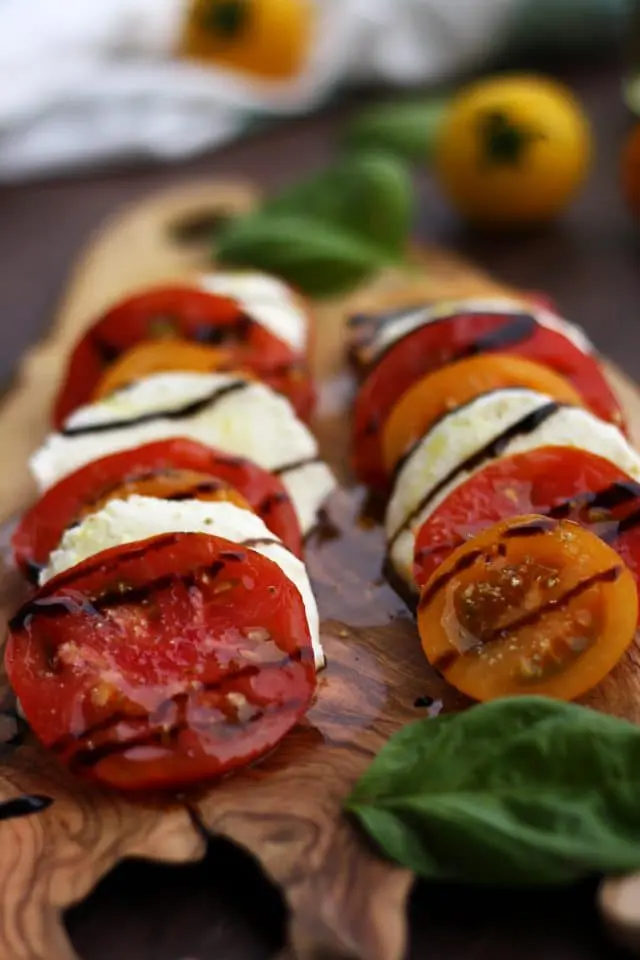 Classic Insalata Caprese (Tomato Mozzarella Salad) is the perfect quick appetizer or salad packed with summer flavors! Light, refreshing and so easy to make! A great way to enjoy in-season tomatoes at the fullest.